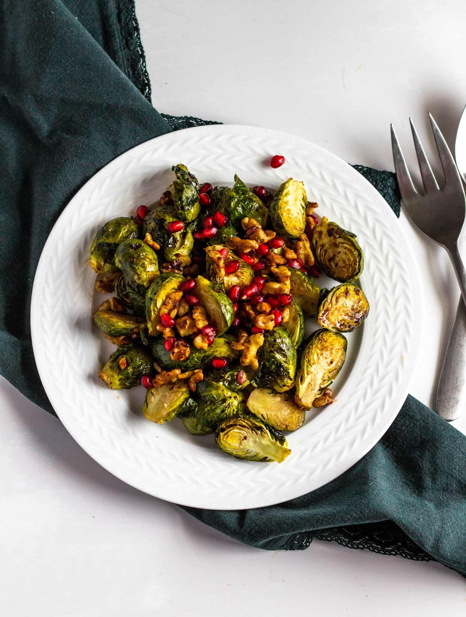 Roasted Brussels Sprouts with Pomegranates and Toasted Walnuts #pomegranate #brusselssprouts #tararochfordnutrition