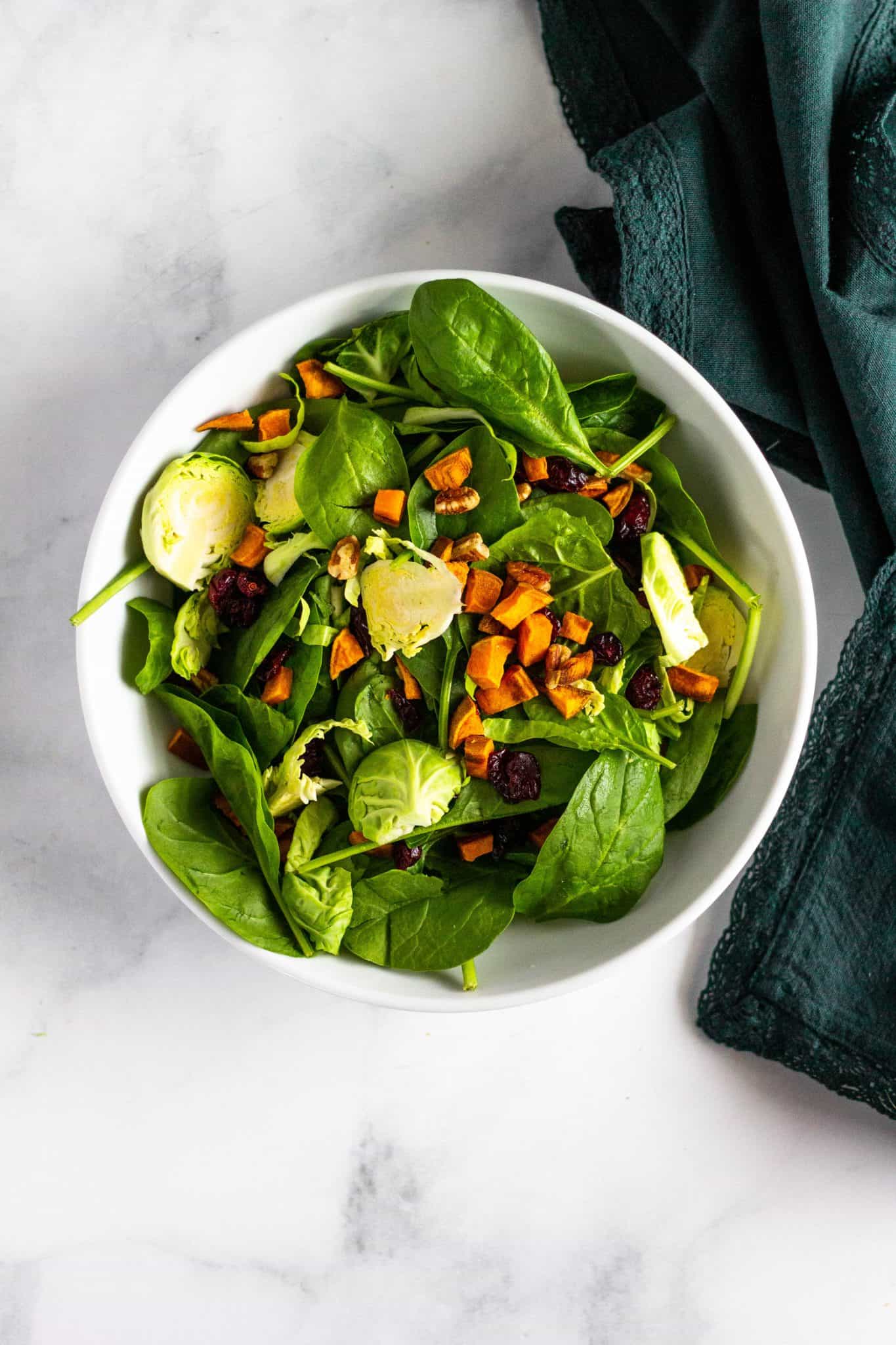 Brussels and Greens Salad with Roasted Sweet Potatoes, Pecans and Cranberries